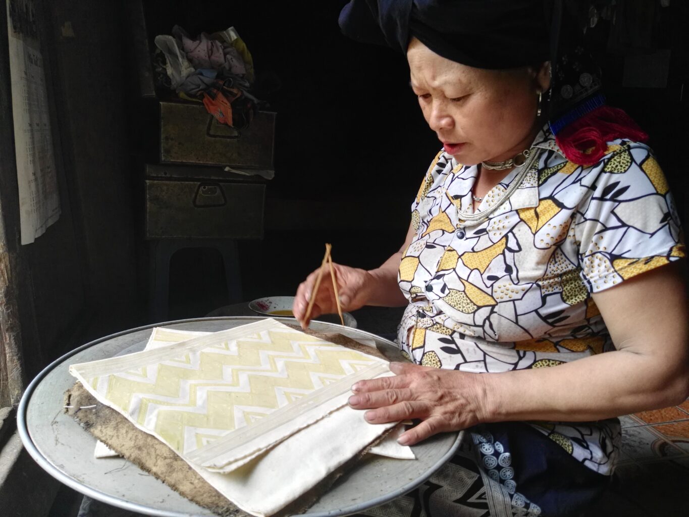 Woman works on traditional brocade handicrafts in Vietnam - Action on Poverty