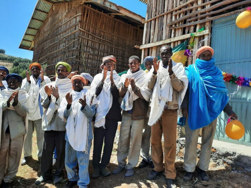 Farmers applauding and smiling at official opening of the new DLS
