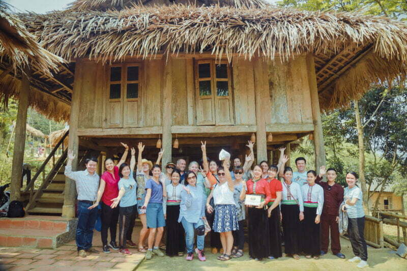 AOP staff and tourists outside a homestay in Hoa Binh, Vietnam